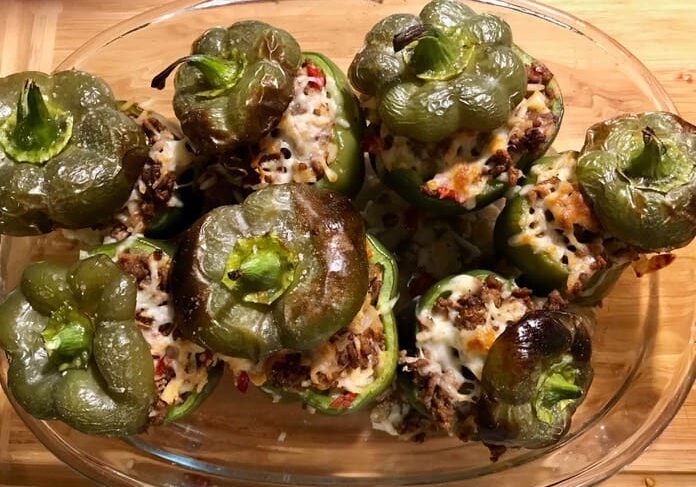 A bowl of stuffed peppers on top of a table.