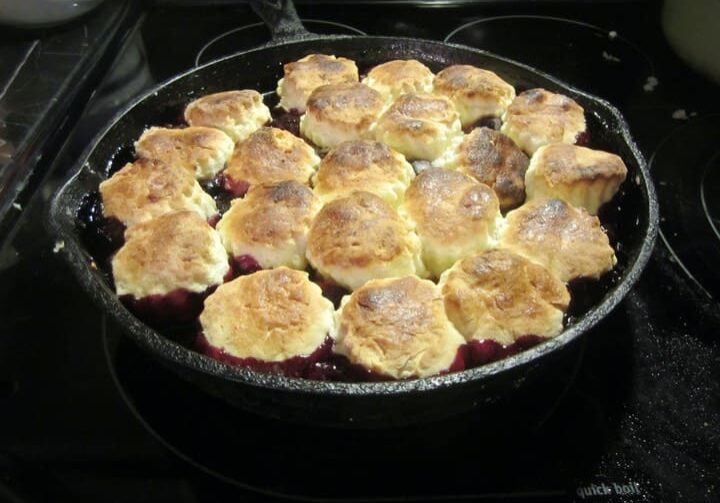 A pan of food on the stove top.