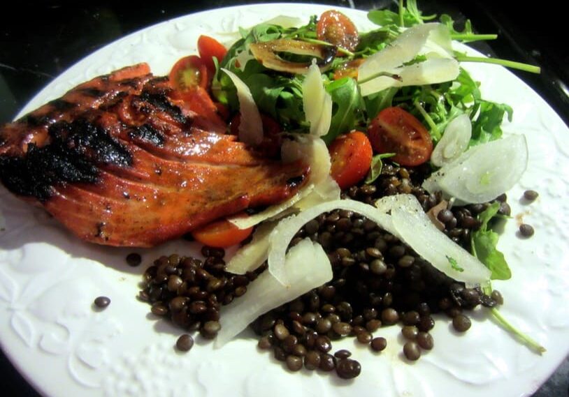 Grilled salmon with lentils and salad.