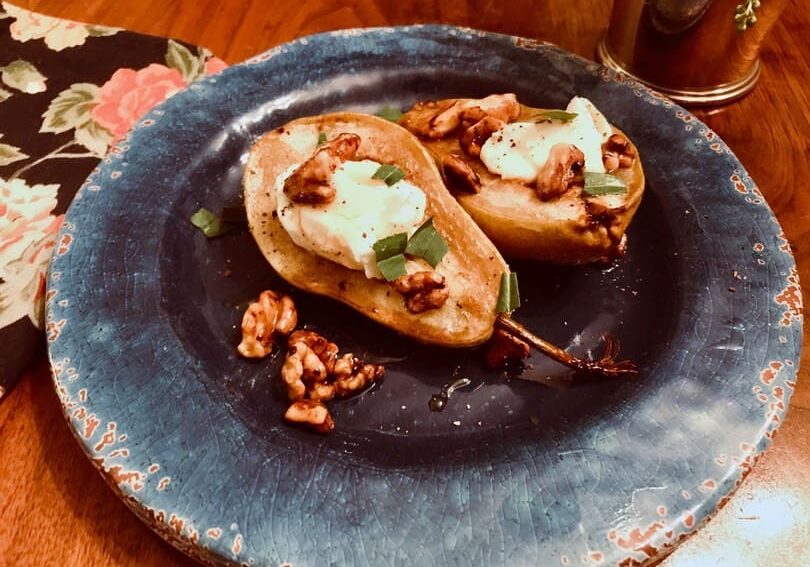 A plate of food on top of a wooden table.