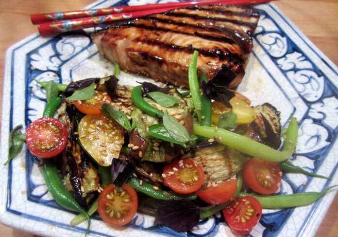 A plate of food with meat and vegetables on it.