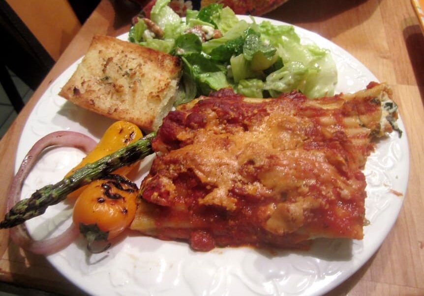 A plate of food with some meat and vegetables on it