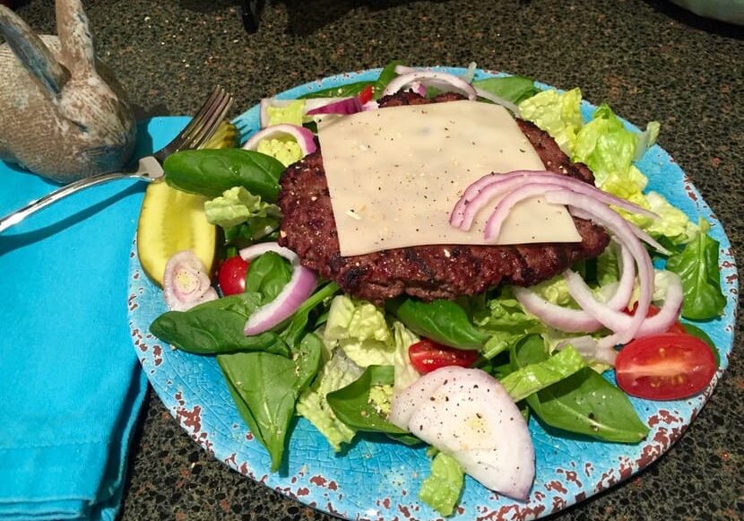 A plate of food with meat and vegetables on it.