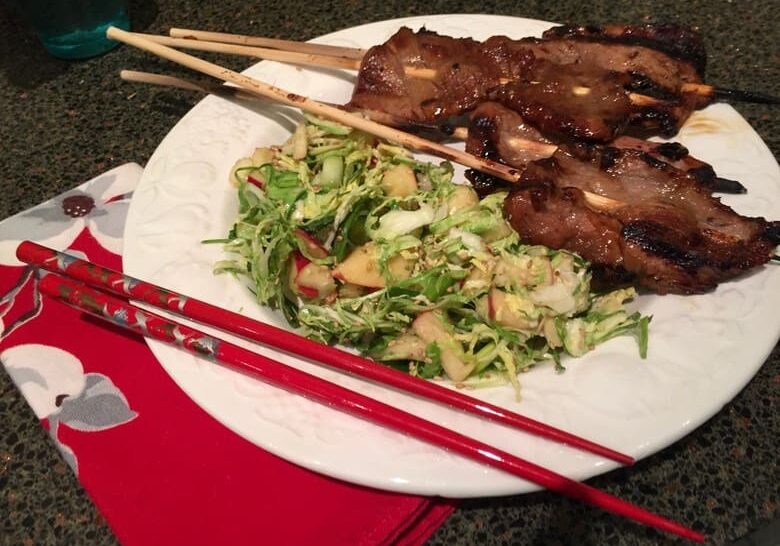 A plate of food with meat and vegetables on it.