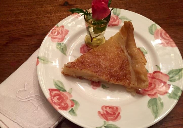 A piece of cake on a plate with roses